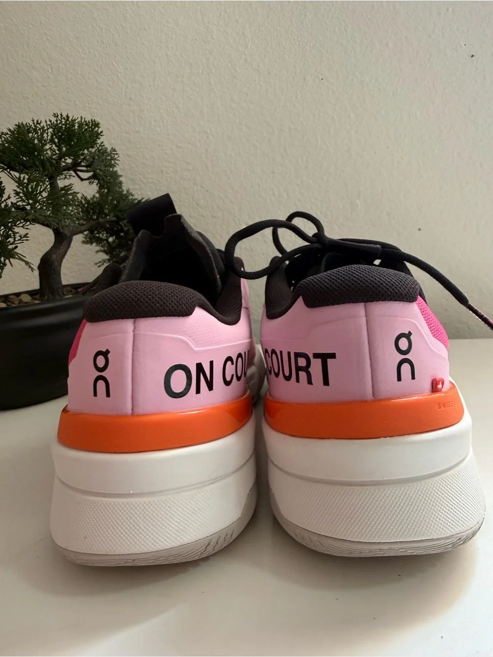 On the Roger pro fire men size 9  or women size 10 pink and Orange Men's Athleti